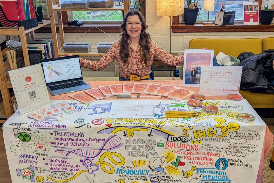 Person sitting at a table with educational materials 