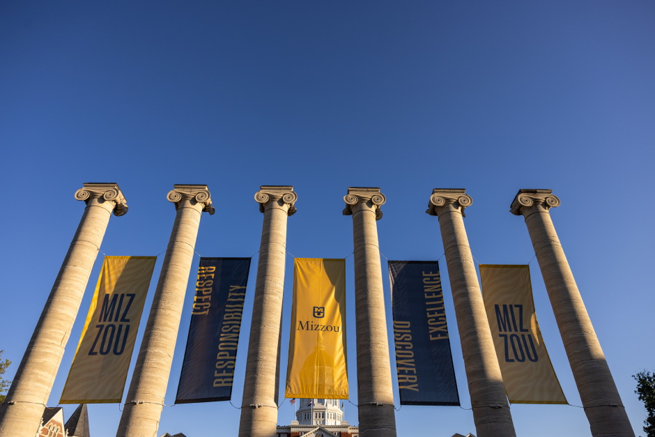 Black and gold banners hang from columns