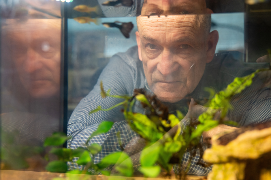 Wes Warren looking at fish.