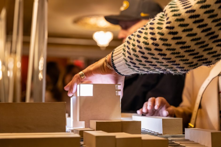A hand lifting an object