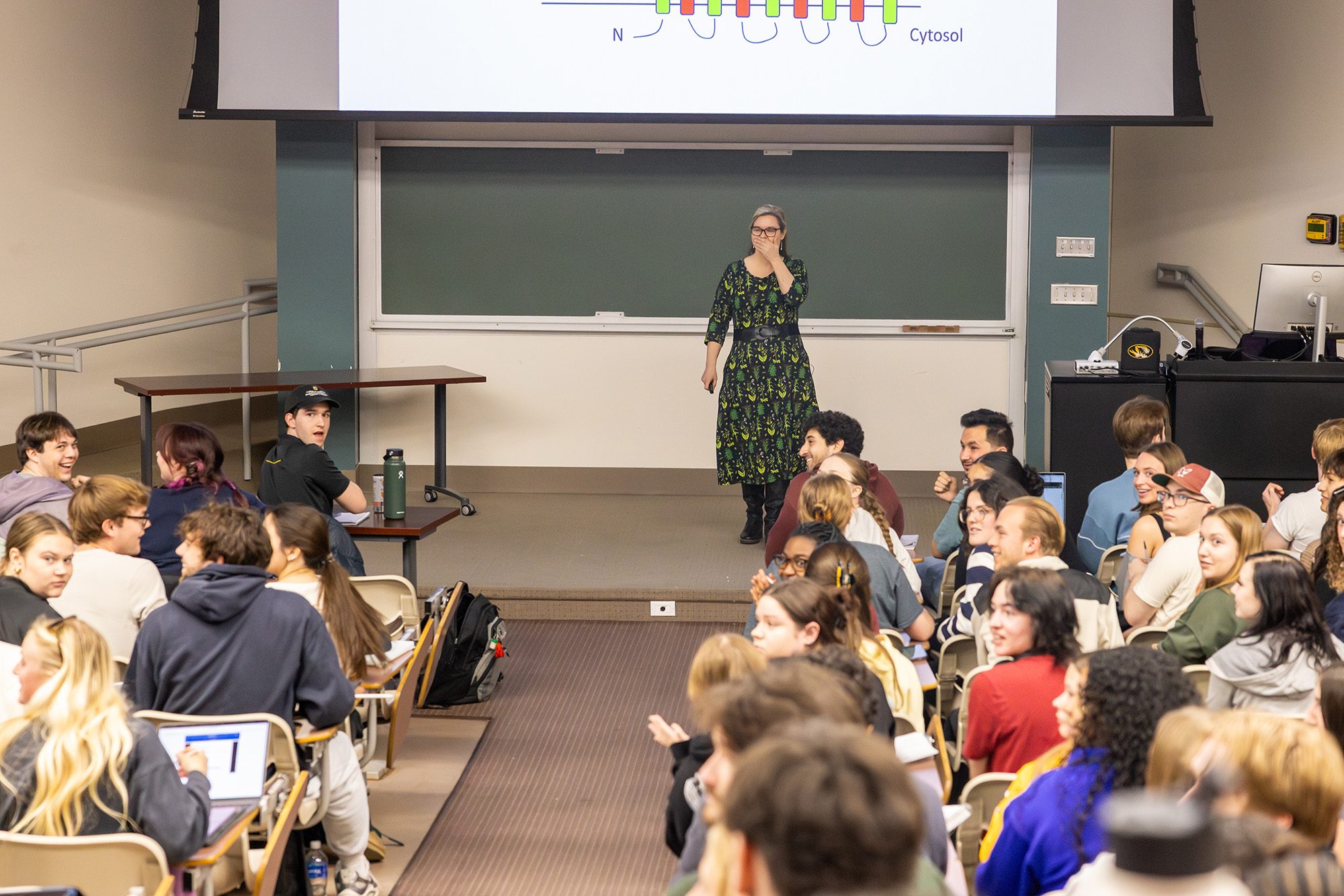 Professor at the front of a classroom