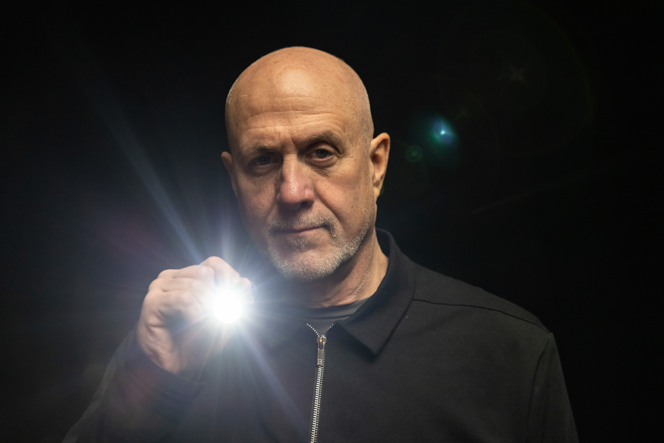 Barry Edwards holding a flashlight.