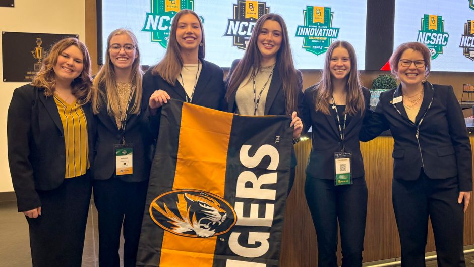 Group of students holding Mizzou Tigers flag