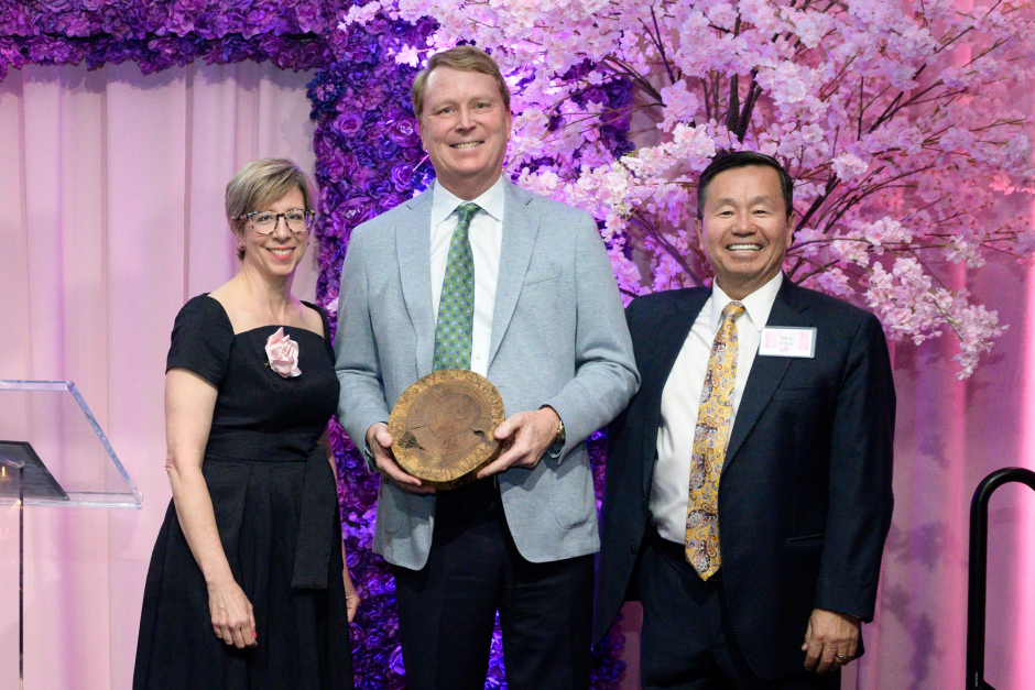 Two people present award 