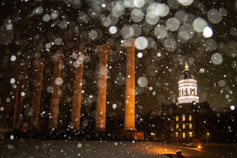 Snow falling at night on the Columns and Jesse Hall