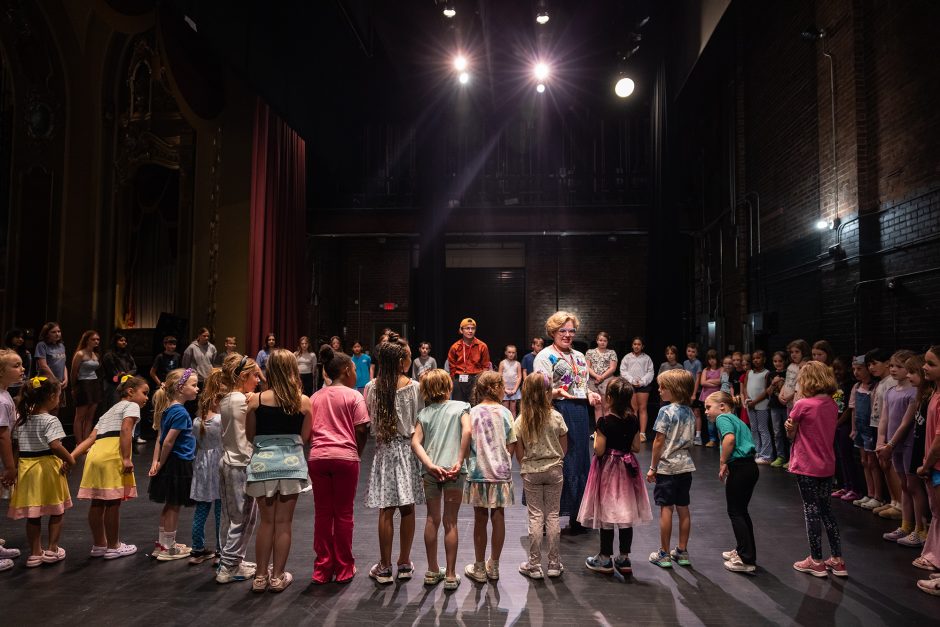 Group of children standing on a stage