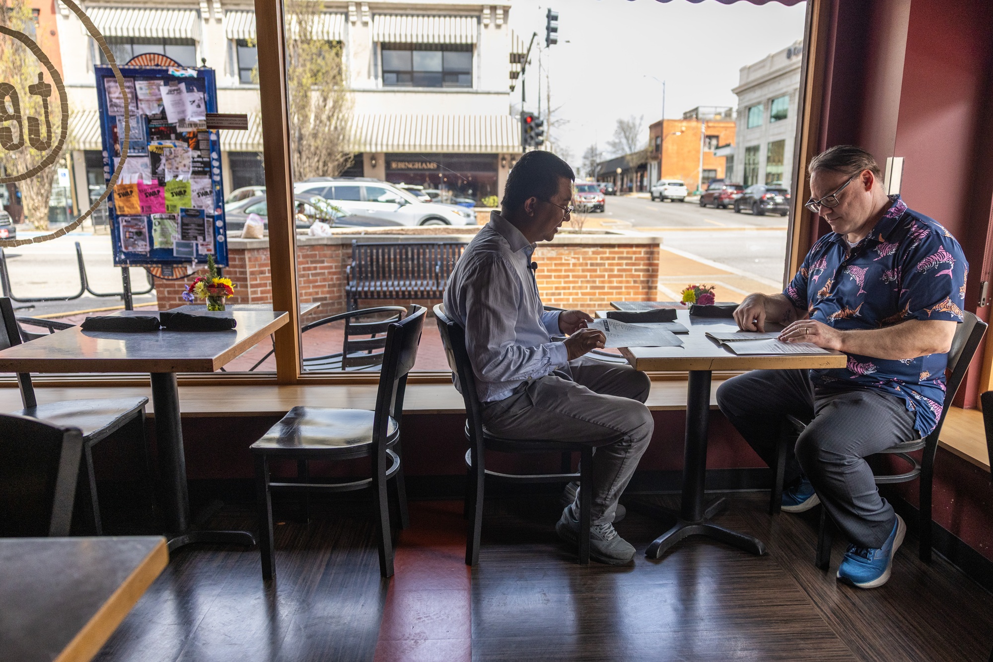 two researchers looking at lunch menus at a downtown Columbia restaurant