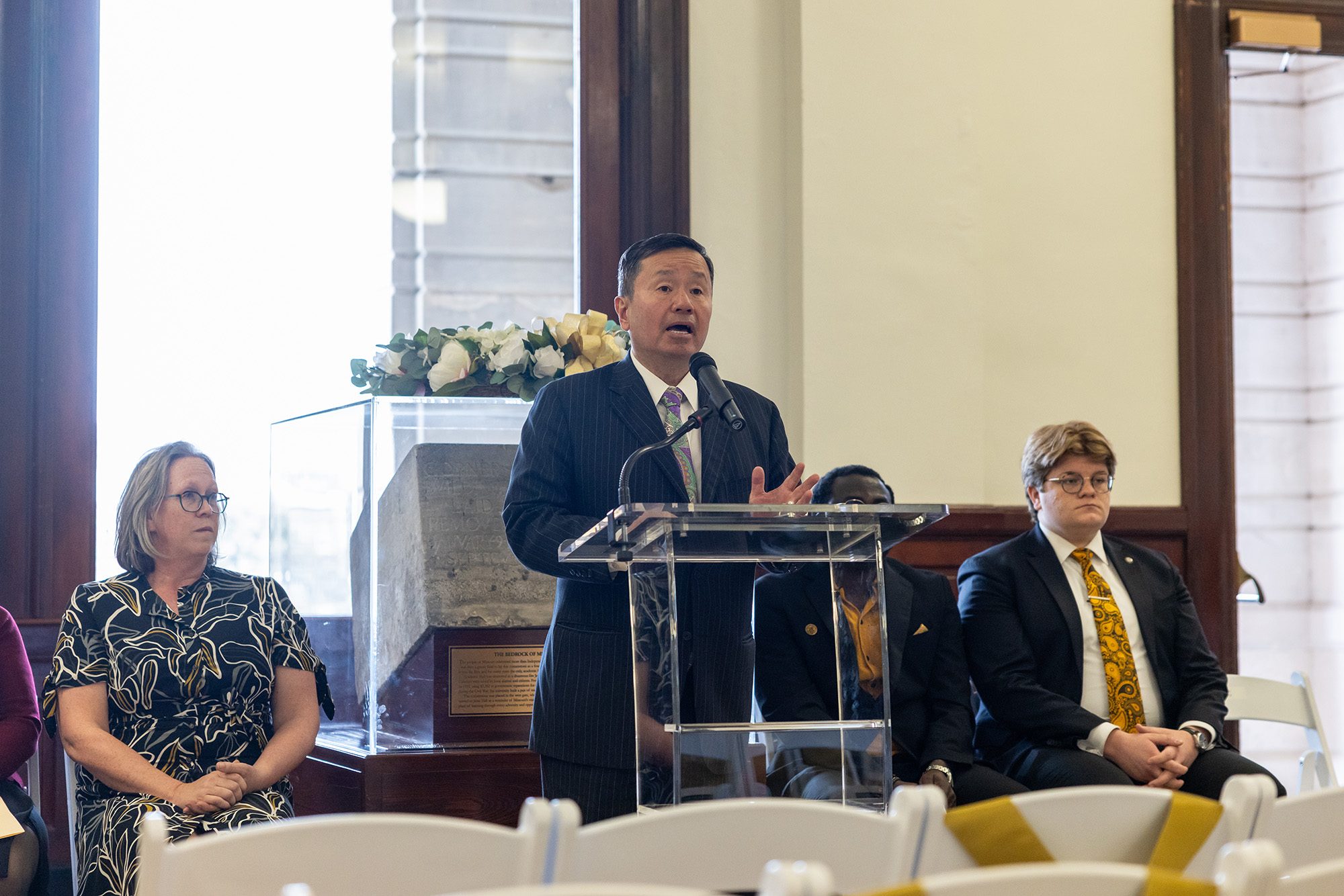 20260410_OP_MU-Remembers-005 Person speaking at a podium