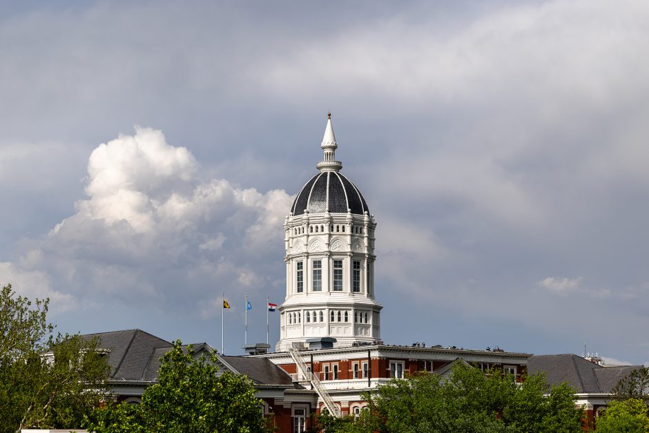 Jesse Hall with a cloudy sky behind it