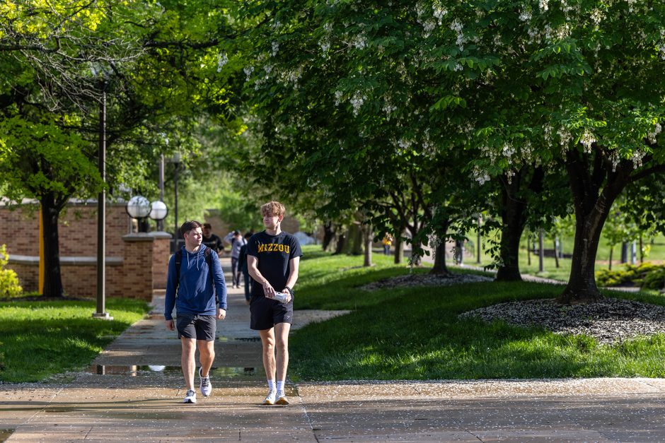 Two students walking on campus