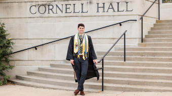 Chase McQueary posing at Cornell Hall.