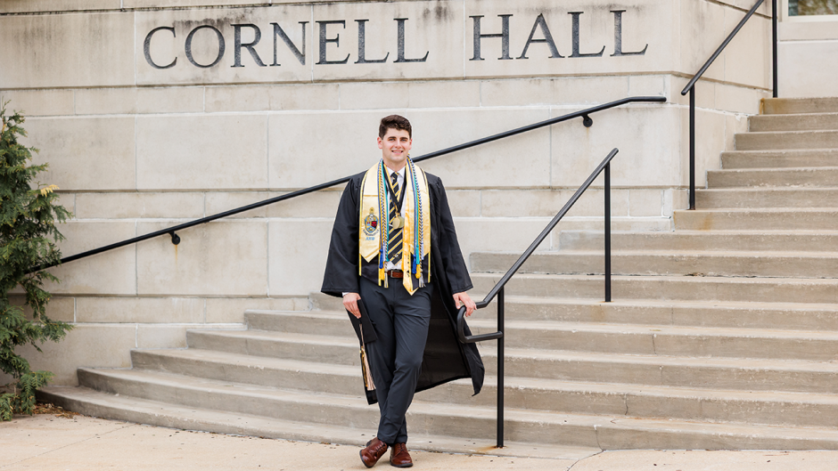 Chase McQueary posing at Cornell Hall.