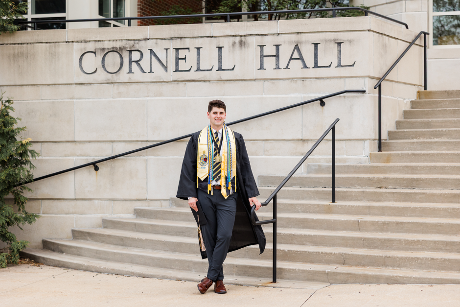 Chase McQueary posing in front of Cornell Hall.