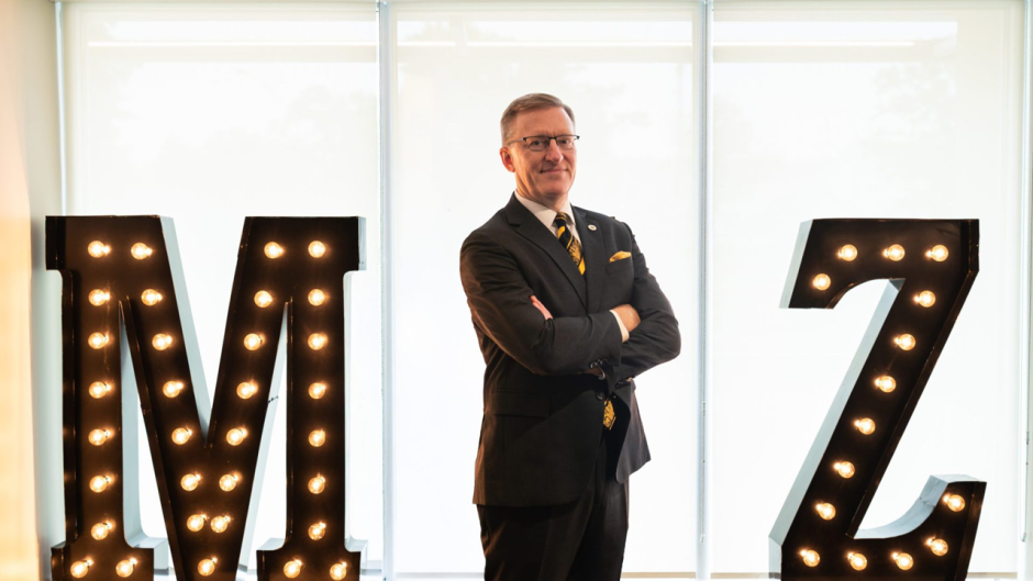 Kristofer Hagglund stands as an "I" between an "M" and a "Z"