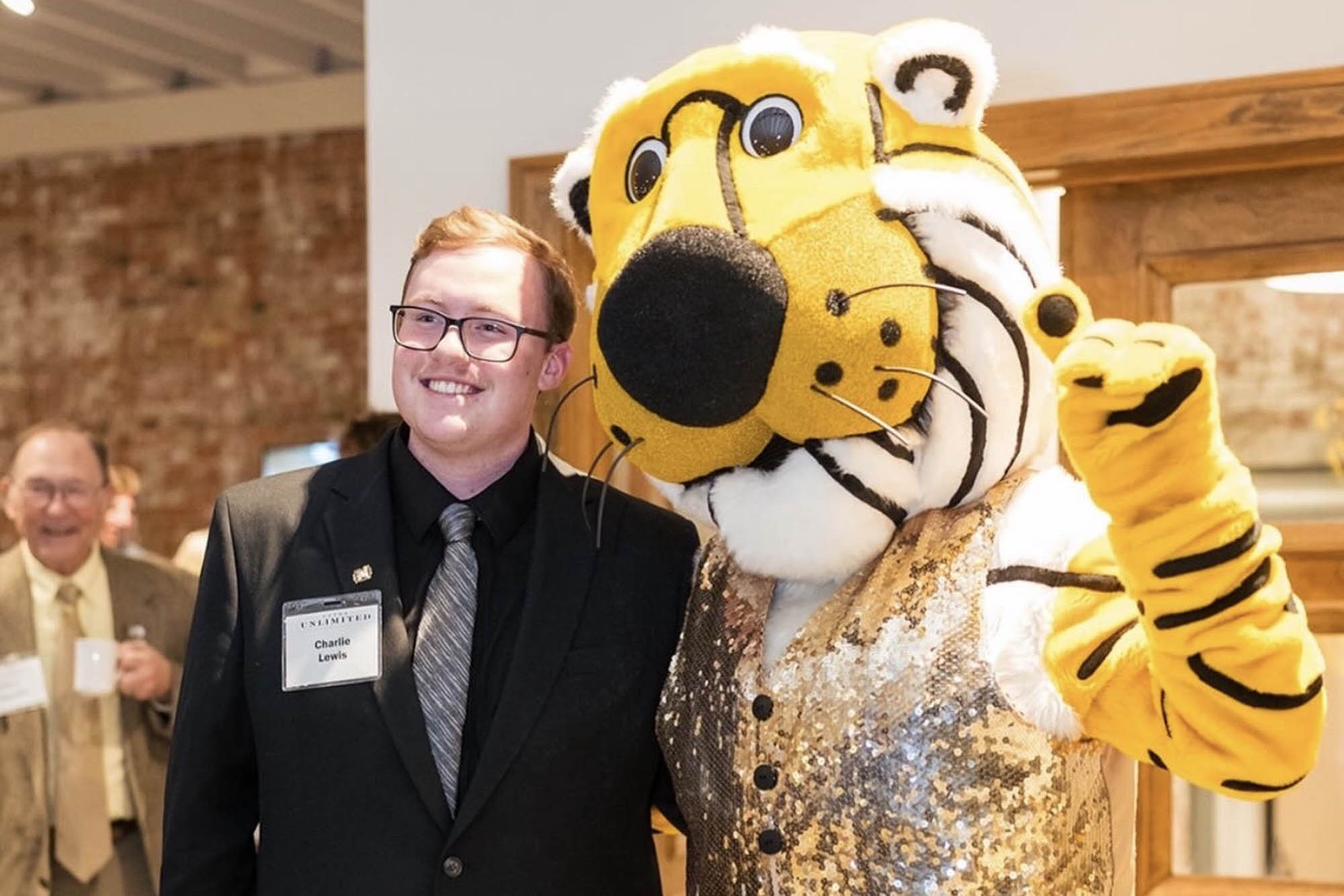 Charlie Lewis with Truman the Tiger