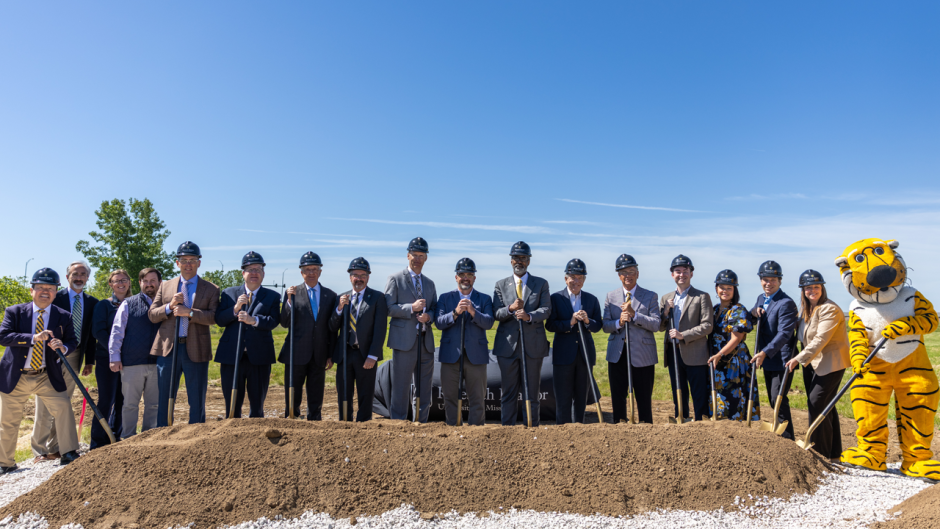 University and state leaders with shovels at groundbreaking.