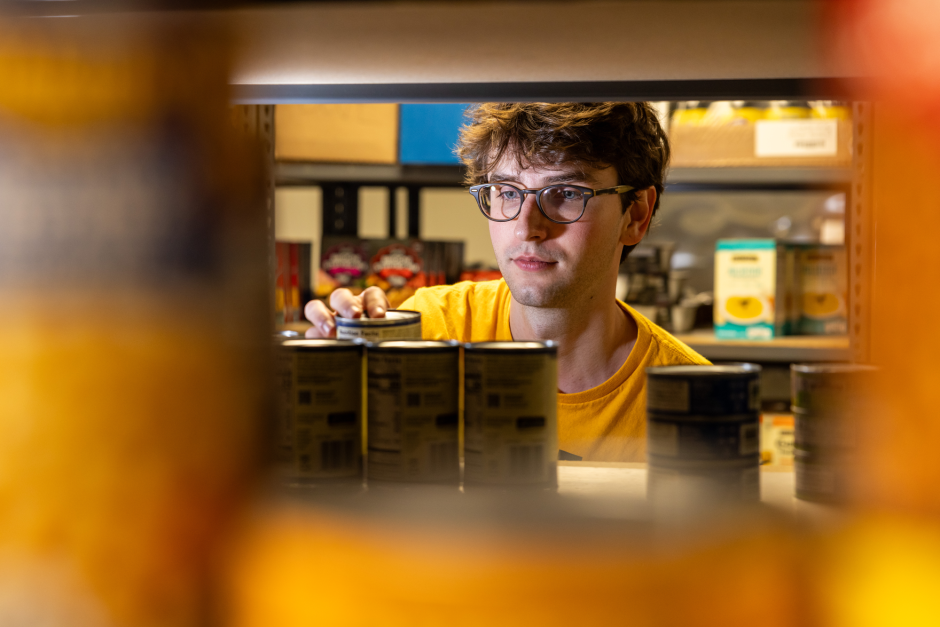 Student stacks canned food
