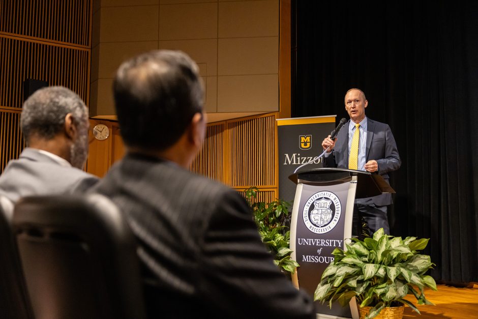 Person speaking at a podium