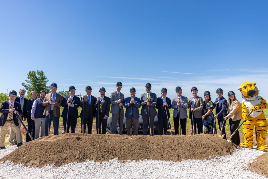 University and state leaders with shovels at groundbreaking.
