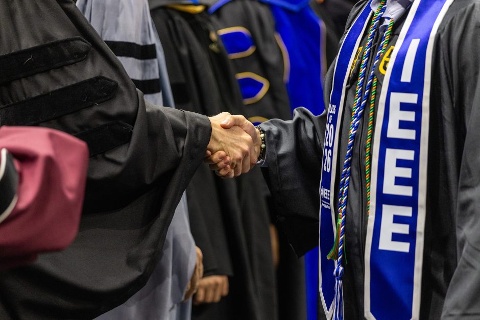 Handshake between graduate and faculty member
