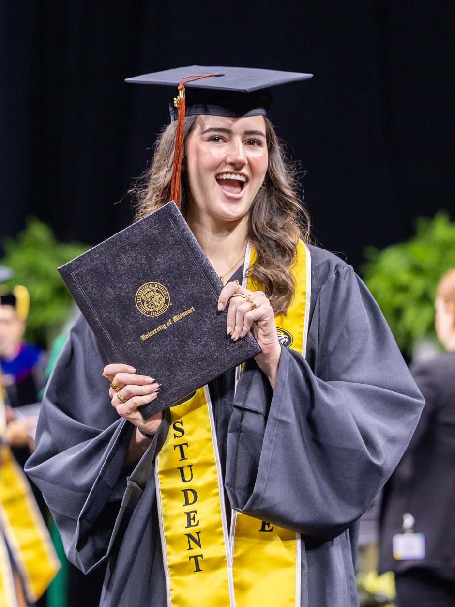 Graduate shows off diploma