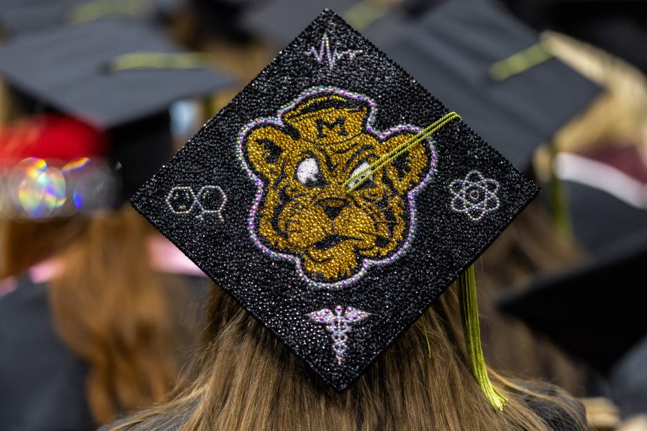 Decorated graduation cap that shows the Sailor Tiger logo