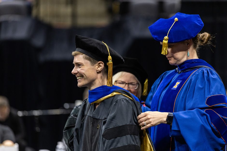 Graduate getting a hood placed on them