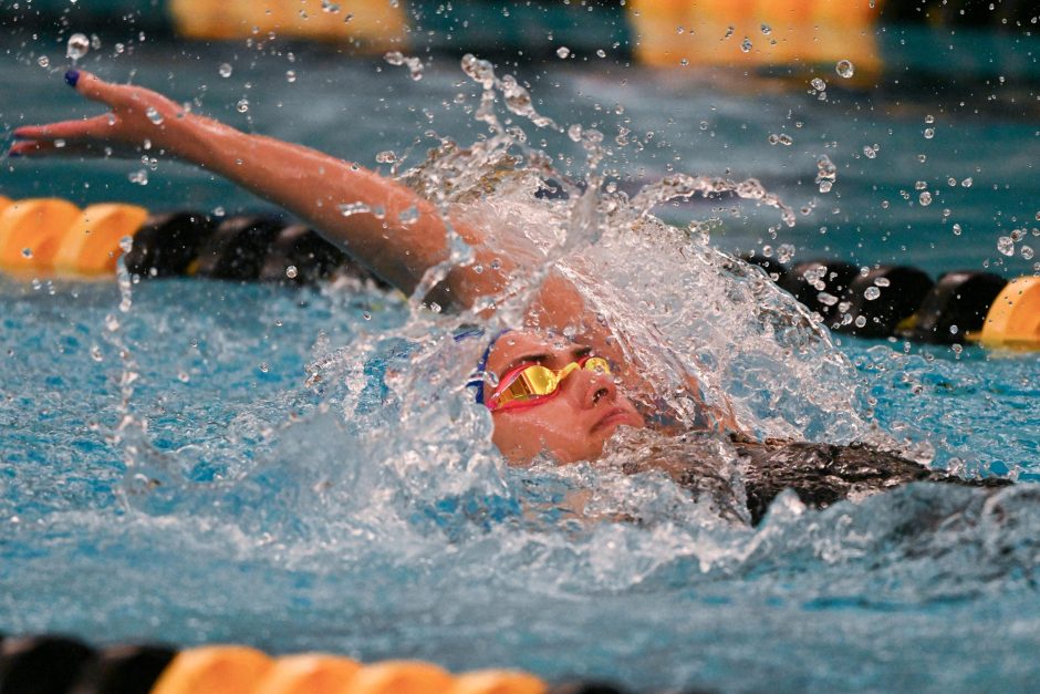 Saint Louis University’s Annabel Banicz swims the backstroke