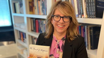 Carli Conklin holds book