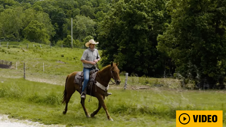 Man on horseback with video play button