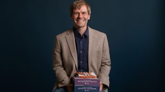 Robert Carpenter holding a collection of products from The Classical Workshop