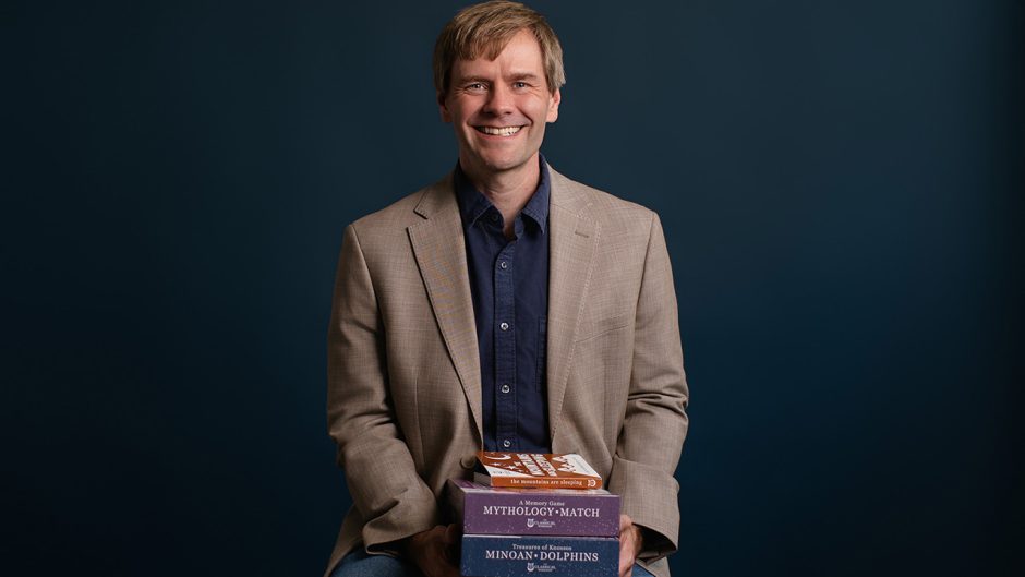 Robert Carpenter holding a collection of products from The Classical Workshop