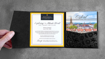 Hand holds Mizzou invitation