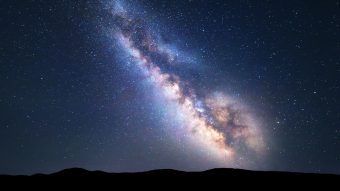 Colorful night landscape with bright milky way