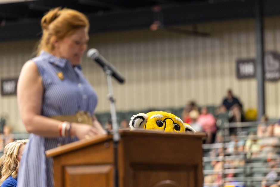 Truman peaks over podium