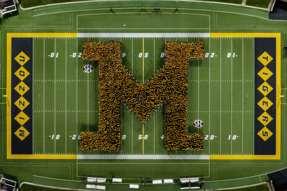Students form an "M" on field