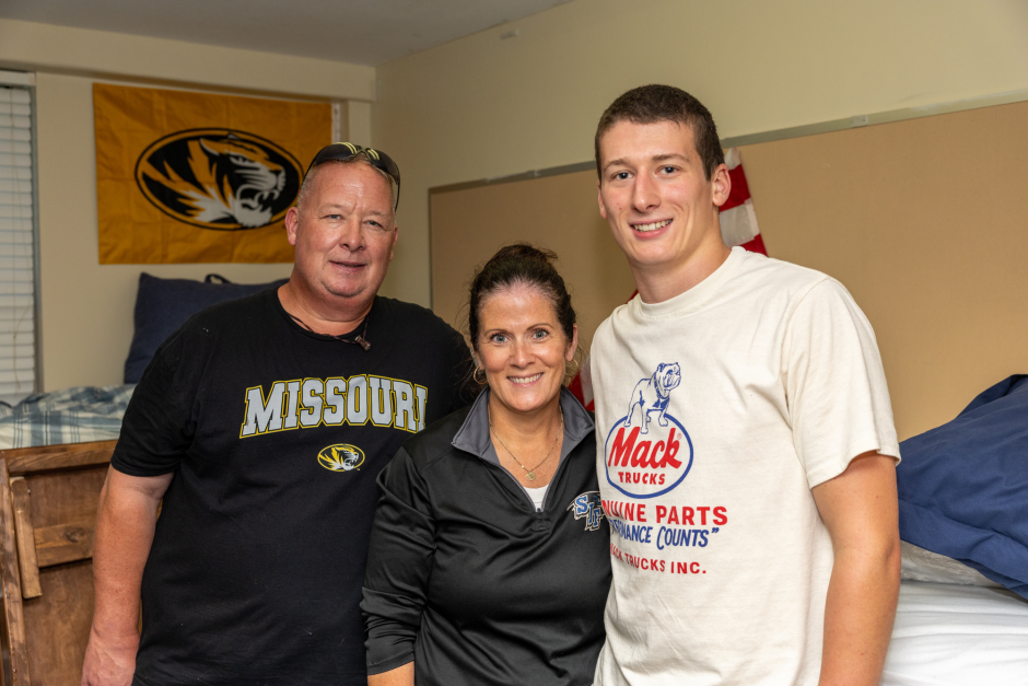 A family in a dorm room