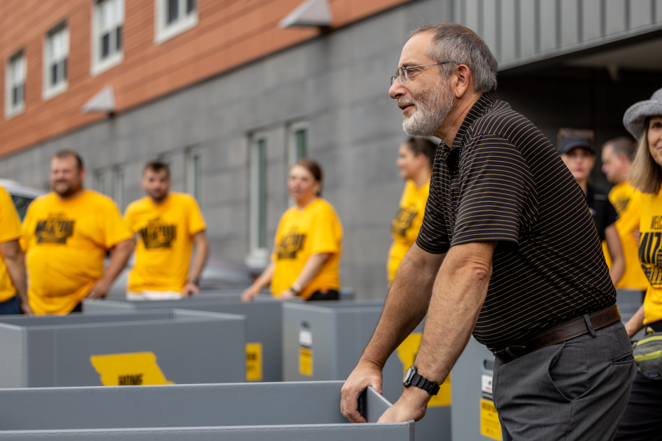 A man moves belongings