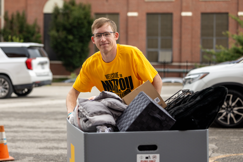 A volunteer moves items