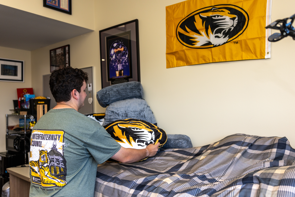 A student decorates a room