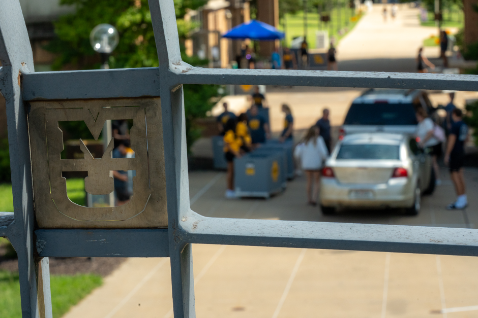 An MU on a window through which you can see people moving in
