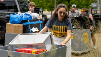 Volunteers move belongings