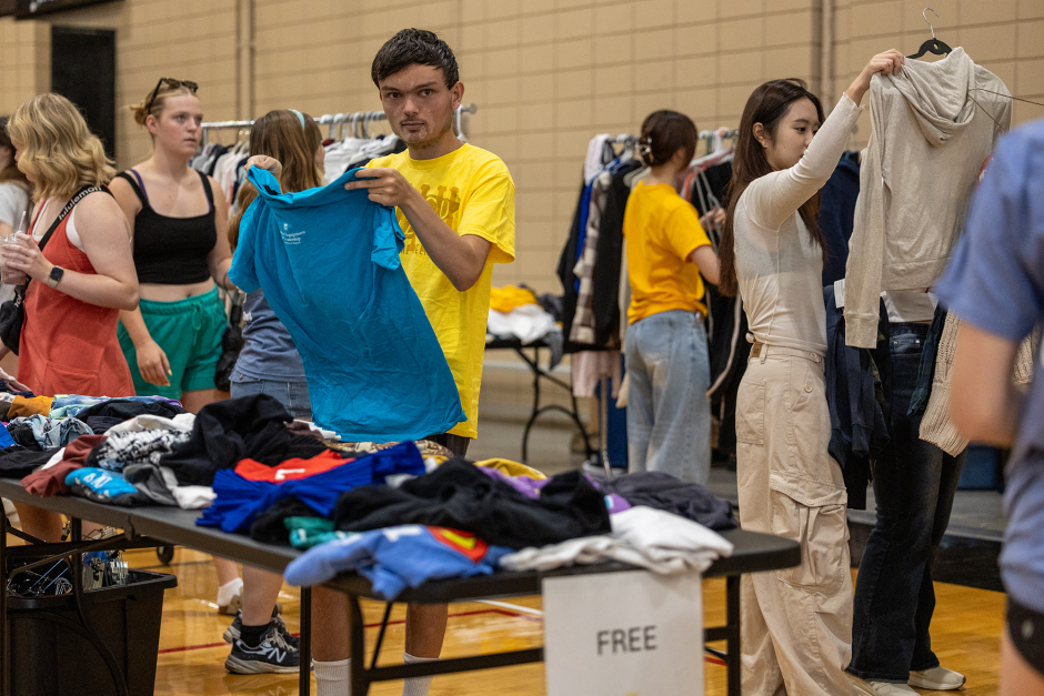 Student picks up blue shirt at sale