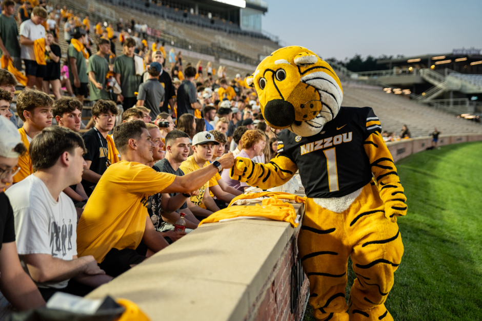 Truman the Tiger greets students