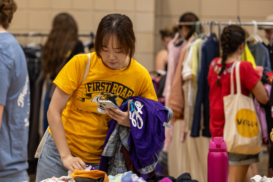 Student in gold shirt shops