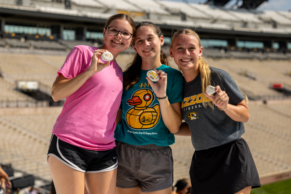 Students pose with rocks