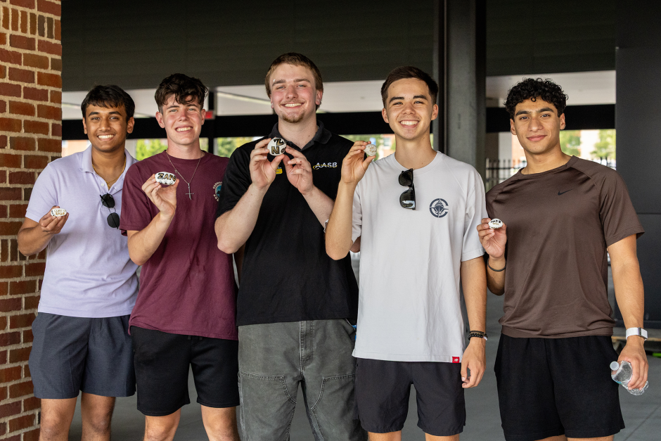 A group of students with rocks