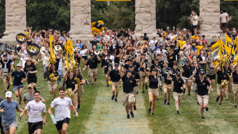 Students run through columns