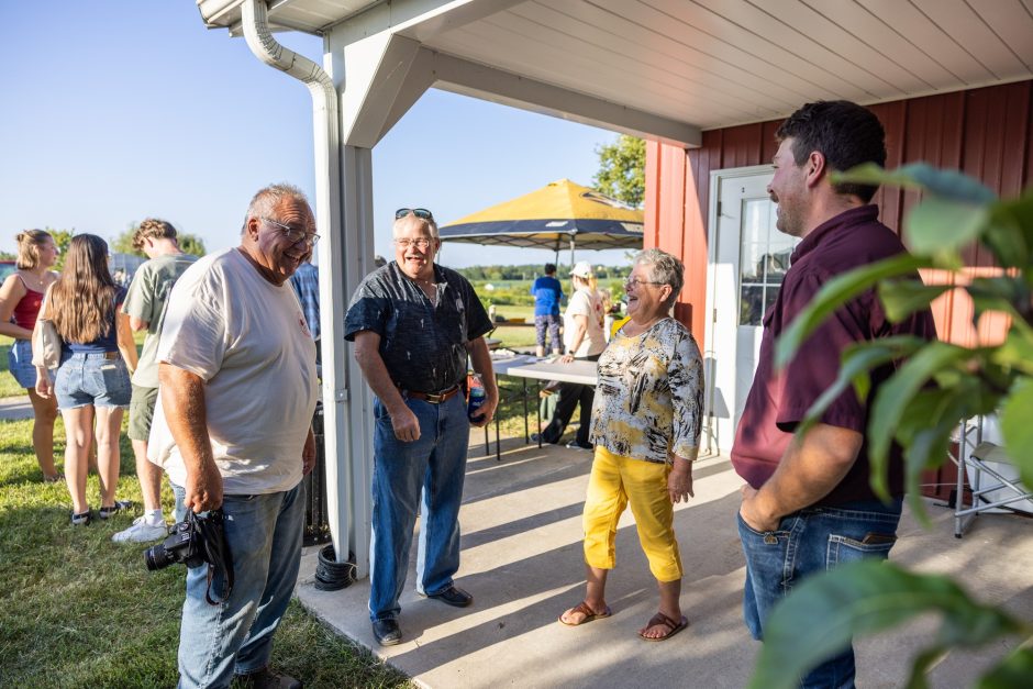 group of people talking at the tomato festival