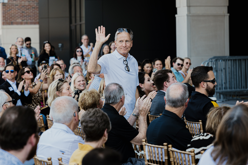 David Payne waves to crowd